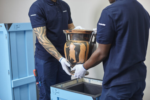 Vase being packed into Constantine Ltd shipping crates