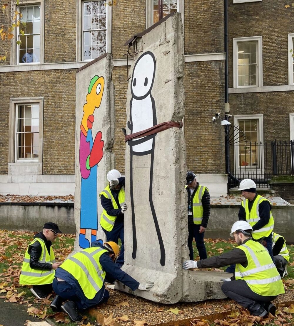 The Constantine team installing sections of the Berlin wall
