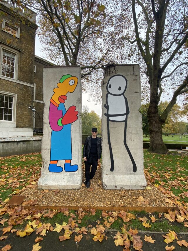 Artist Stik outside the IWM with artwork
